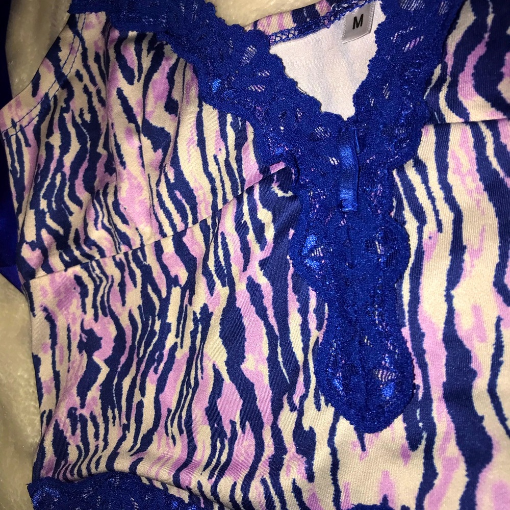 Laced zebra print crop tank top with ribbon stash. Size medium.